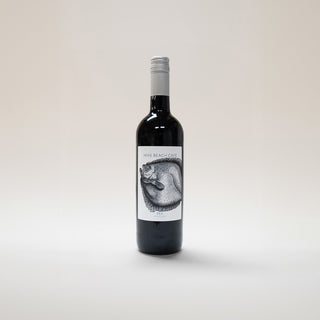 bottle of red wine with a fish illustration on it on a white background