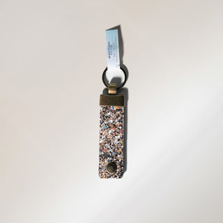 Keychain with multicolored speckled design made from recycled plastics
