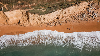 drone view of cliffs at hive beach