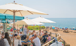 outdoor cafe seating area on the beach